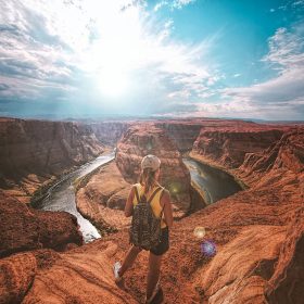 Woman standing on top of canyon